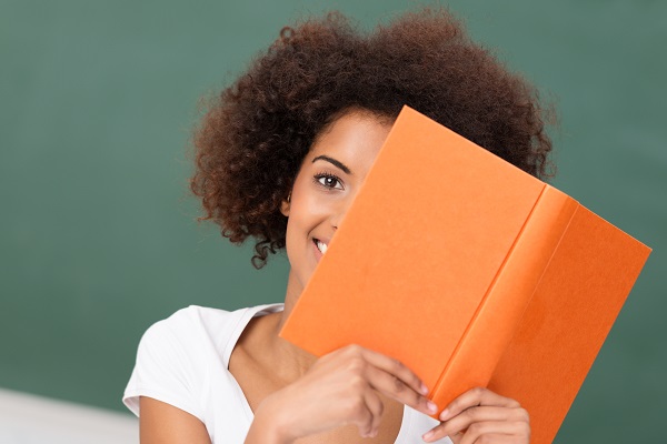 African American woman reading a book